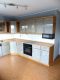 Ruhige Lage! Freistehendes Wohnhaus mit vier großen Garagen, Spitzboden ausgebaut, teilw. renoviert - Küche mit EBK